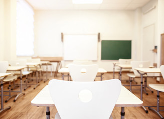 Sticker - Empty classroom with chairs and desks