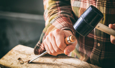 Carpenter working with a chisel