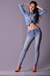 © babenkolev - Young sexy asian  denim style model  posing standing on a gray background