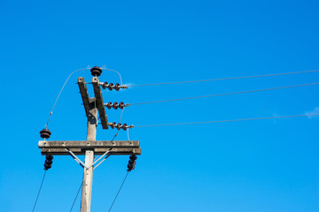 Electric pole at sky background.High voltage post.High-voltage tower at sky background