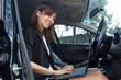 © KSPTT6 - Asian woman with a laptop in her car, woman work in car,