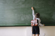 © Jose Luis Carrascosa Martinez/ADDICTIVE STOCK - A kid cleaning the blackboard