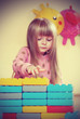 The four-year girl playing and learning in kindergarten vintage