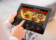 © Kaspars Grinvalds - Woman ordering pizza online