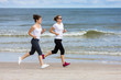 © Jacek Chabraszewski - Two women running on beach