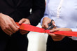 © Kalim - Businesspeople cutting the ribbon