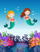Two Mermaids Swimming Under The Ocean