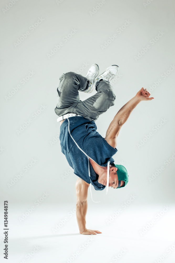 Man break dancer on white studio background - obrazy, fototapety, plakaty 