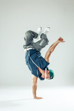 Man break dancer on white studio background