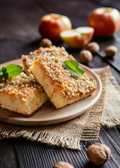 Wall Mural - Juicy fruit cake topped with grated apple and walnut