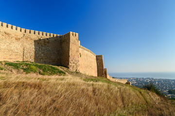 Wall Mural - Wall of Naryn-Kala fortress and view of Derbent city.