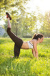 © Bojan - Healthy young sportswoman doing the exercises on all fours arching back straightening leg up outdoors. Concept sport, fitness, lifestyle.