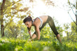 © Bojan - Young health woman doing stretching exercise relaxing and warm up after jogging and running in park.