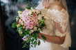© alex_shifer - the bride holding a bouquet. wedding flowers. soft focus.