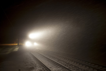 headlights of train in winter night