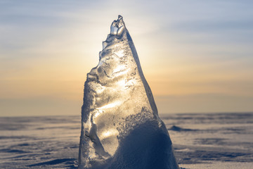Wall Mural - blocks of ice gleaming in the sun, snow, frost, frozen water surface.