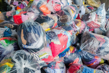 old second-hand clothes in plastic bags