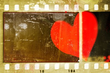 Poster - Vintage film strip frame with single heart. Valentines Day concept.