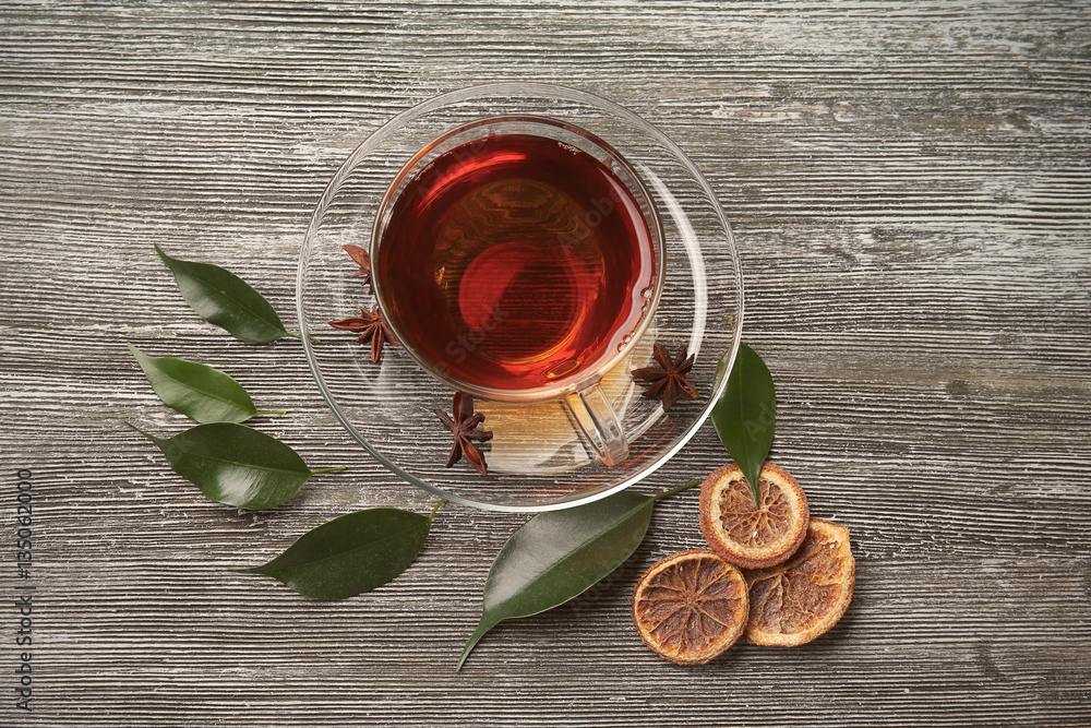 Cup with hot tea  on wooden background
