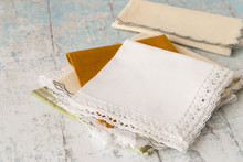 
 Handkerchiefs.   Net Neatly Folded Handkerchiefs On The Old Wooden Table.