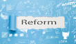 reform text written paper on blue background