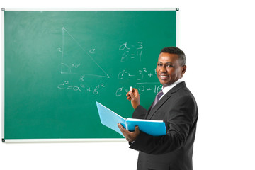 Canvas Print - Indian teacher explaining math formulas written on blackboard