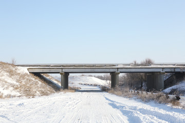 Sticker - Country side empty road covered with snow on sunny day