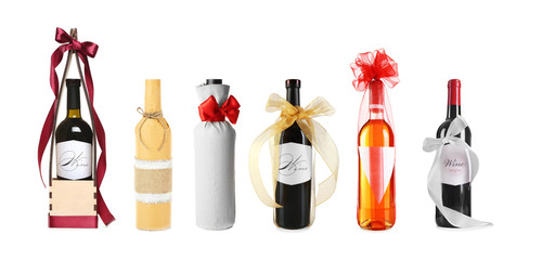 Poster - Set of wine bottles with festive decor on white background