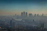 Fototapeta  - a morning in London with a view of Canary Wharf with smog, air pollution