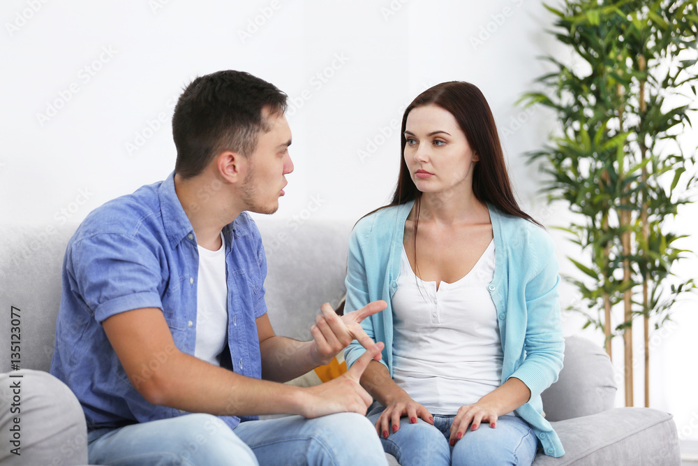 Young couple in quarrel at home