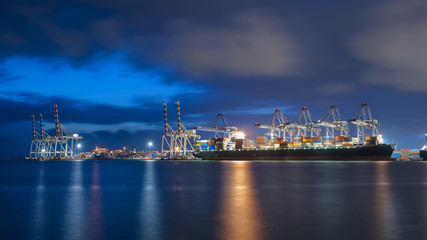 Wall Mural - Container ship in import, export port against  twilight