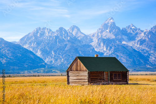 Grand Teton National Park Wyoming Wood Cabin On A Golden Grass