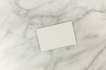 Wall Mural - Blank business card on white marble texture