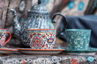 © eriyalim - vintage tea cup painted in colorful floral pattern