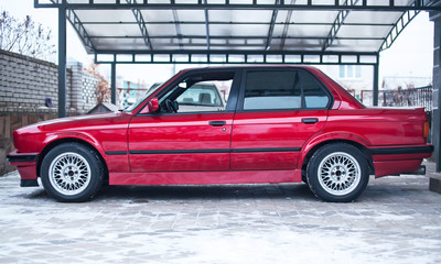 Restored red old car, which looks like new. Side view