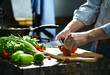 © Denis Aglichev - Chef cuts the tomatoes with a knife