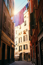 Colorful Linen Drying Between Houses In Old Italian Street