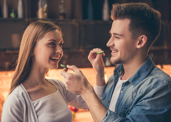 Wall Mural - Beautiful couple cooking