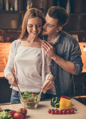 Wall Mural - Beautiful couple cooking