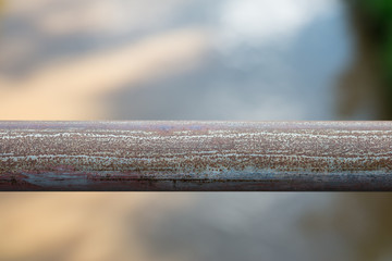 Wall Mural - Rust on steel pipe foreground with blur bokeh background