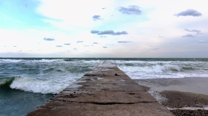 Wall Mural - View of the pier and the sea in windy weather