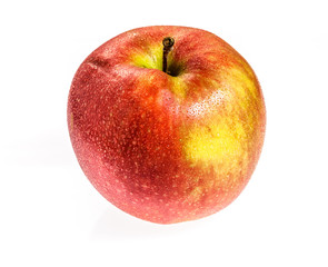 Water drops on a red Apple. Isolated on a white background.