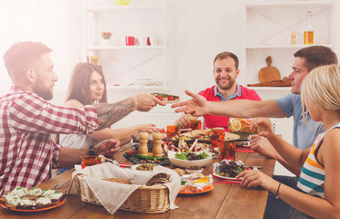 Wall Mural - People eat healthy food at festive table dinner party