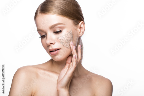 Beautiful young girl with scrub on the skin and French manicure Fototapete