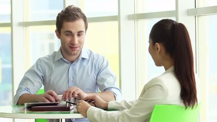 Wall Mural - Two colleagues interacting at business meeting