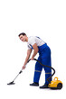© Elnur - Man in coveralls doing vacuum cleaning on white
