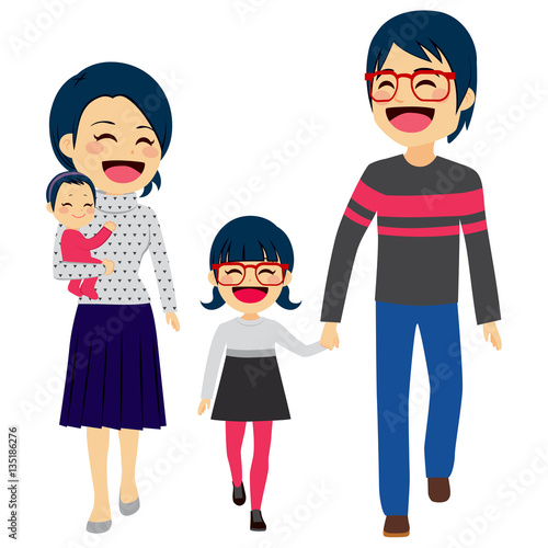 Cute happy four member Asian family walking together smiling