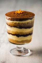 Tiramisu dessert on a grey rustic table