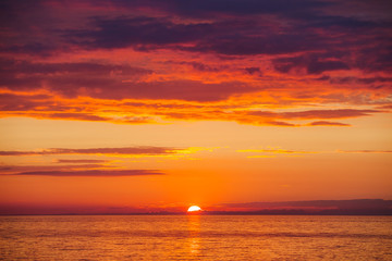  Amazing gold orange sky and water of Baltic sea at sunset