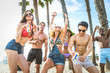 © oneinchpunch - Friends partying on the beach